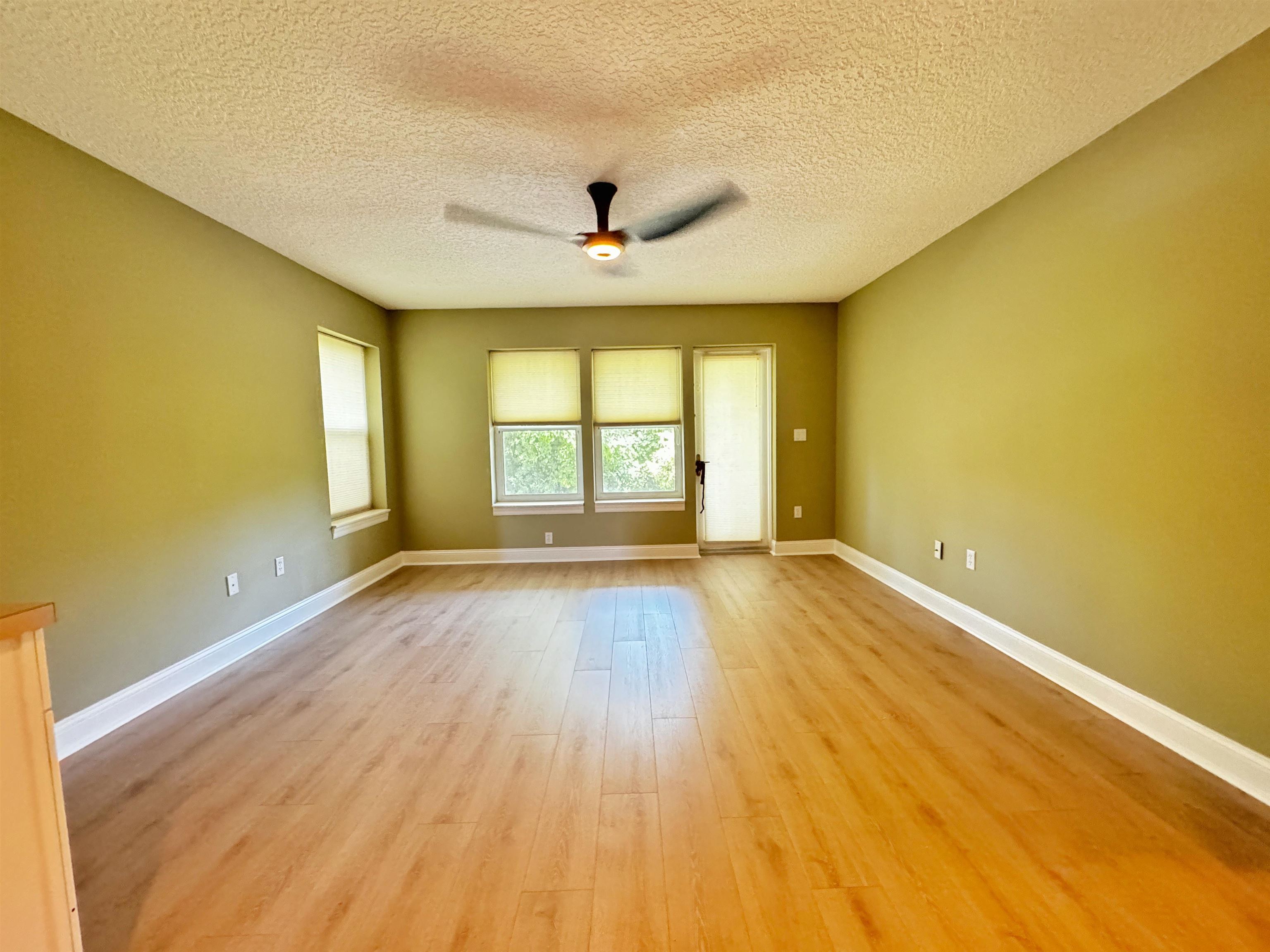 113 Sunset Circle South St. Augustine, FL 32080 - Photo 25 of 33 wooden floor in an empty room with a window