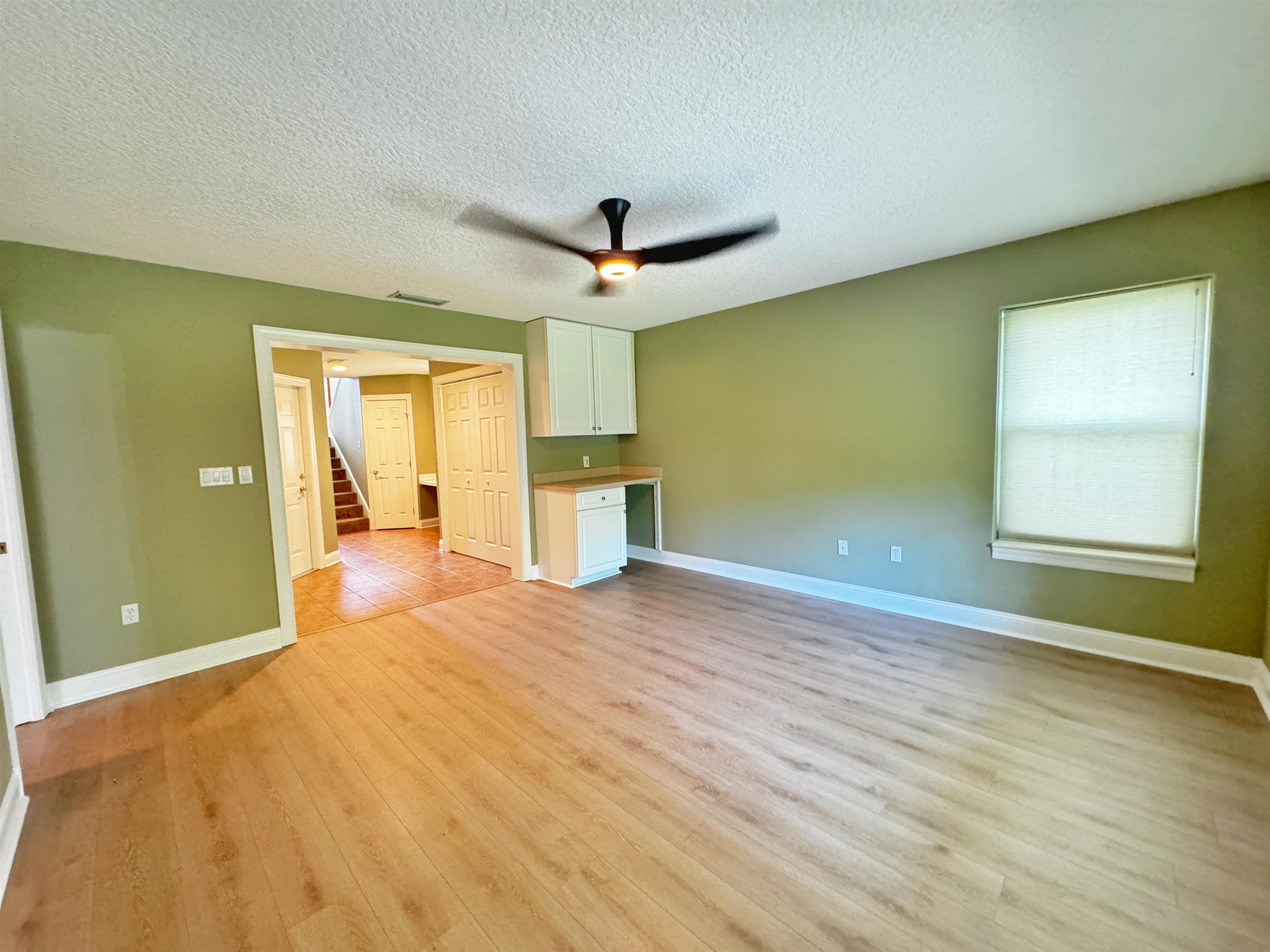 113 Sunset Circle South St. Augustine, FL 32080 - Photo 26 of 33 a view of empty room with wooden floor and fan