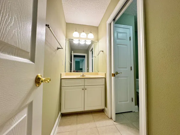 a bathroom with a sink a mirror and a shower
