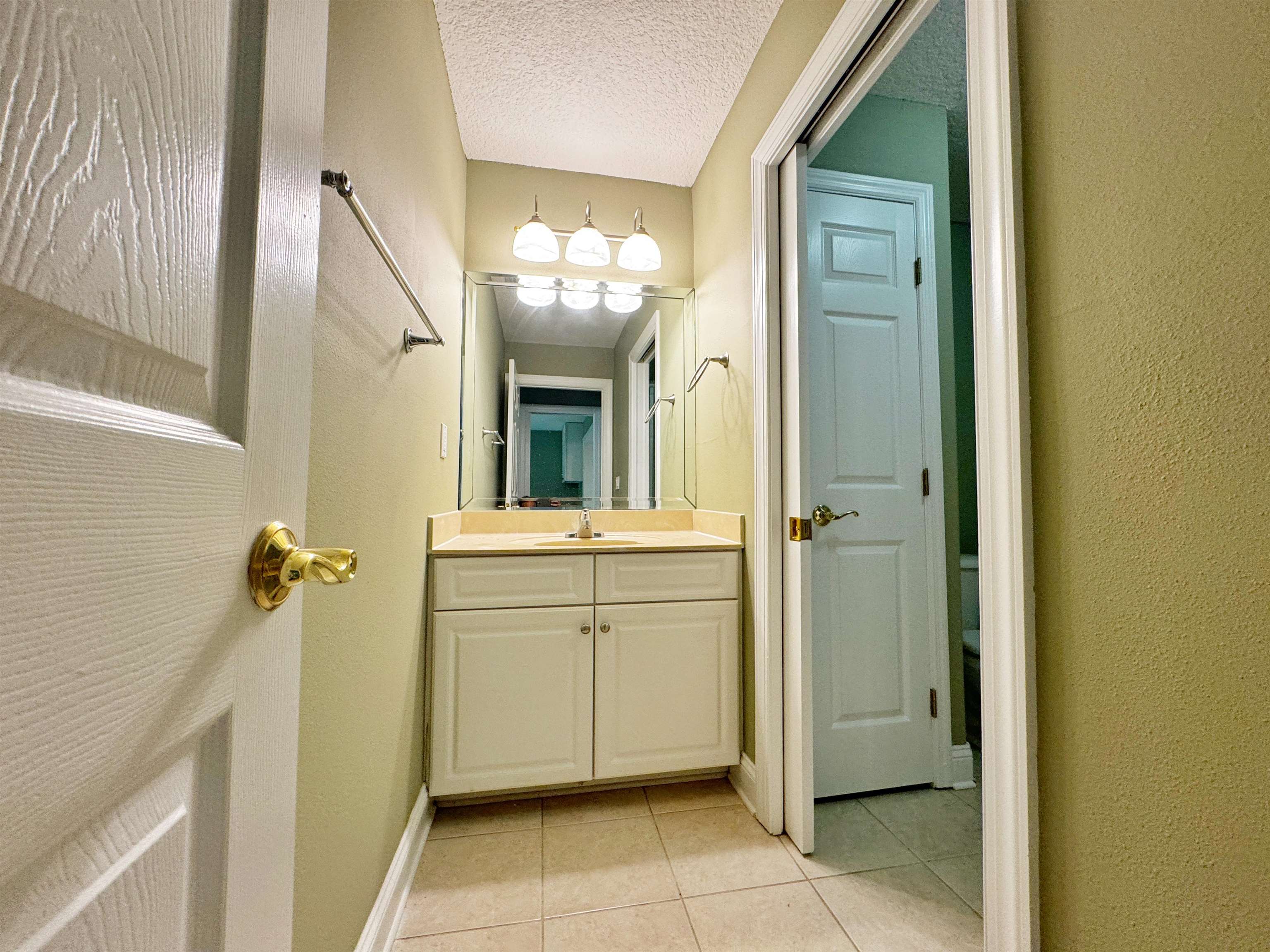113 Sunset Circle South St. Augustine, FL 32080 - Photo 29 of 33 a bathroom with a sink a mirror and a shower