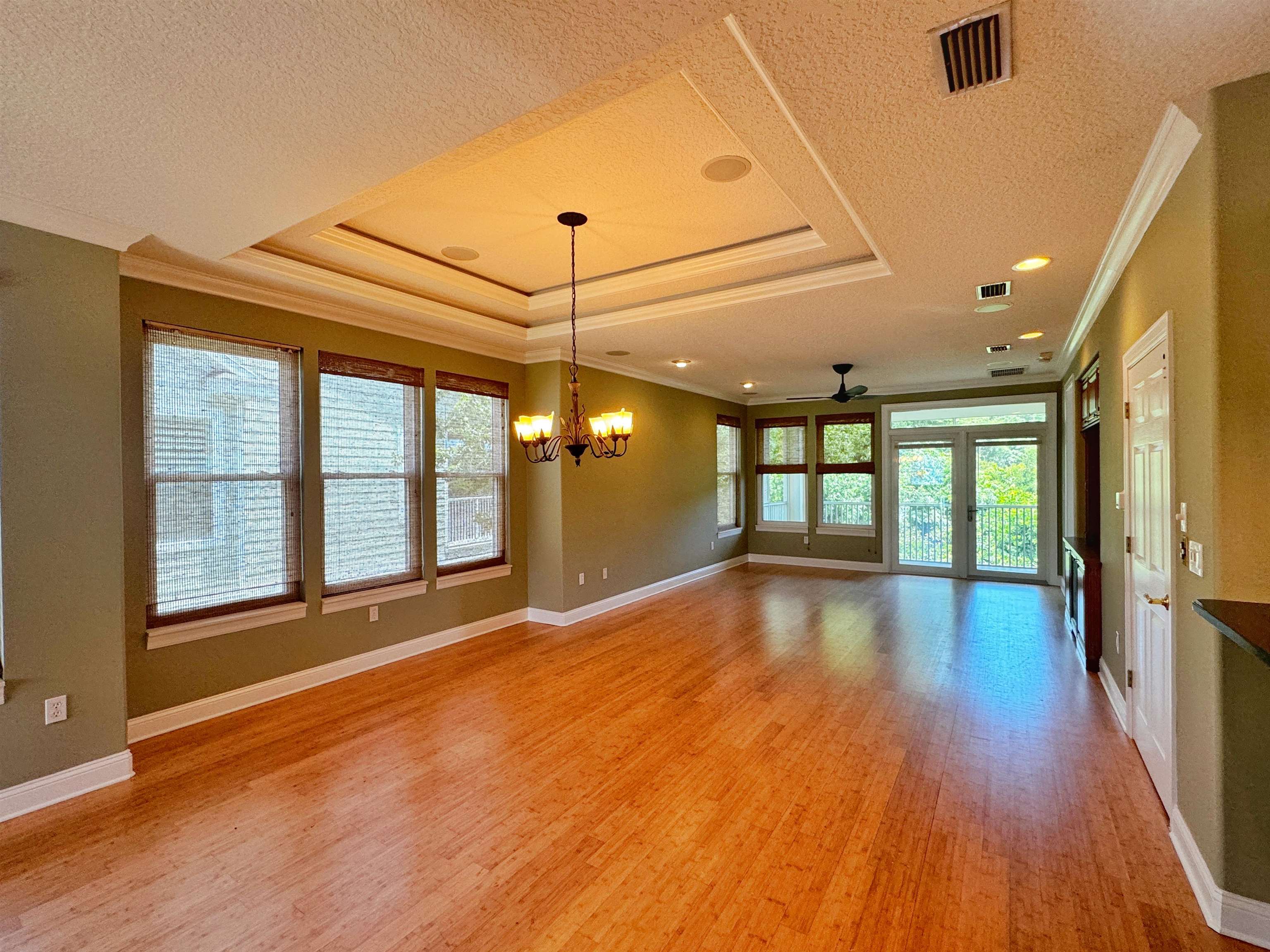 113 Sunset Circle South St. Augustine, FL 32080 - Photo 3 of 33 a view of an empty room with wooden floor and a window