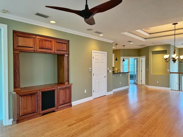 a view of a livingroom with wooden floor