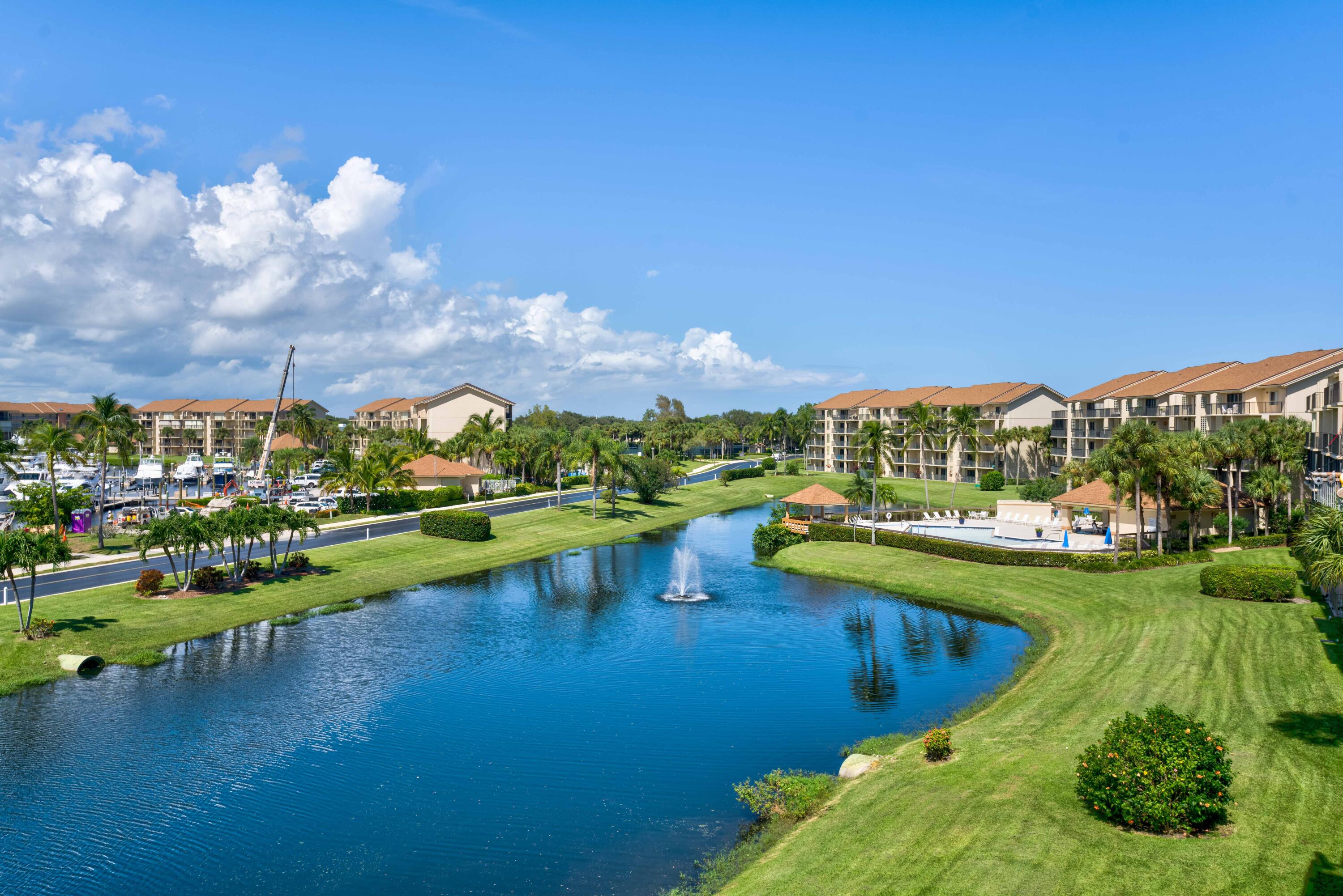 801 Seafarer Circle, Unit 404 Jupiter, FL 33477 - Photo 1 of 34 a view of a lake with houses