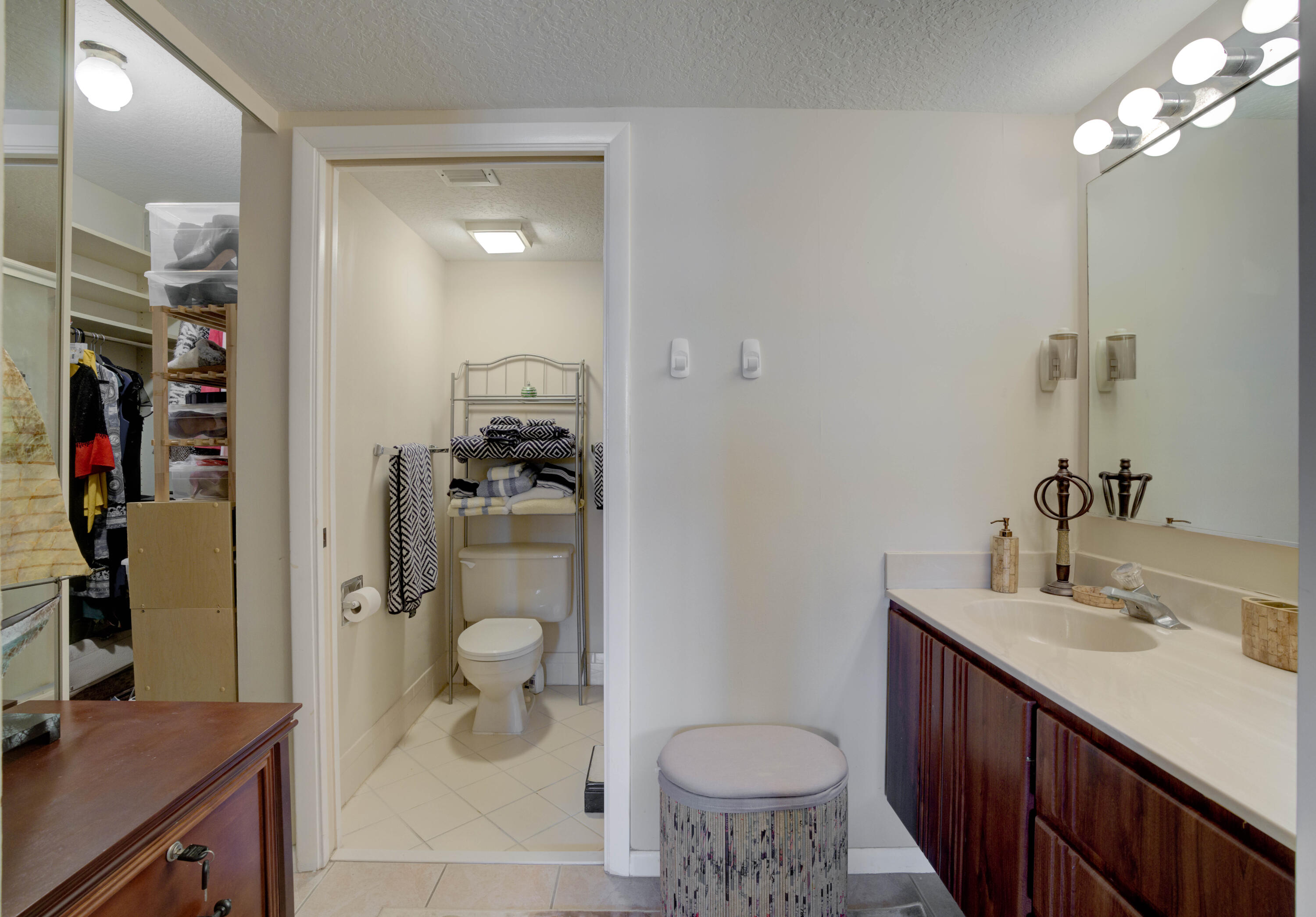 801 Seafarer Circle, Unit 404 Jupiter, FL 33477 - Photo 11 of 34 a bathroom with a sink a toilet and shower