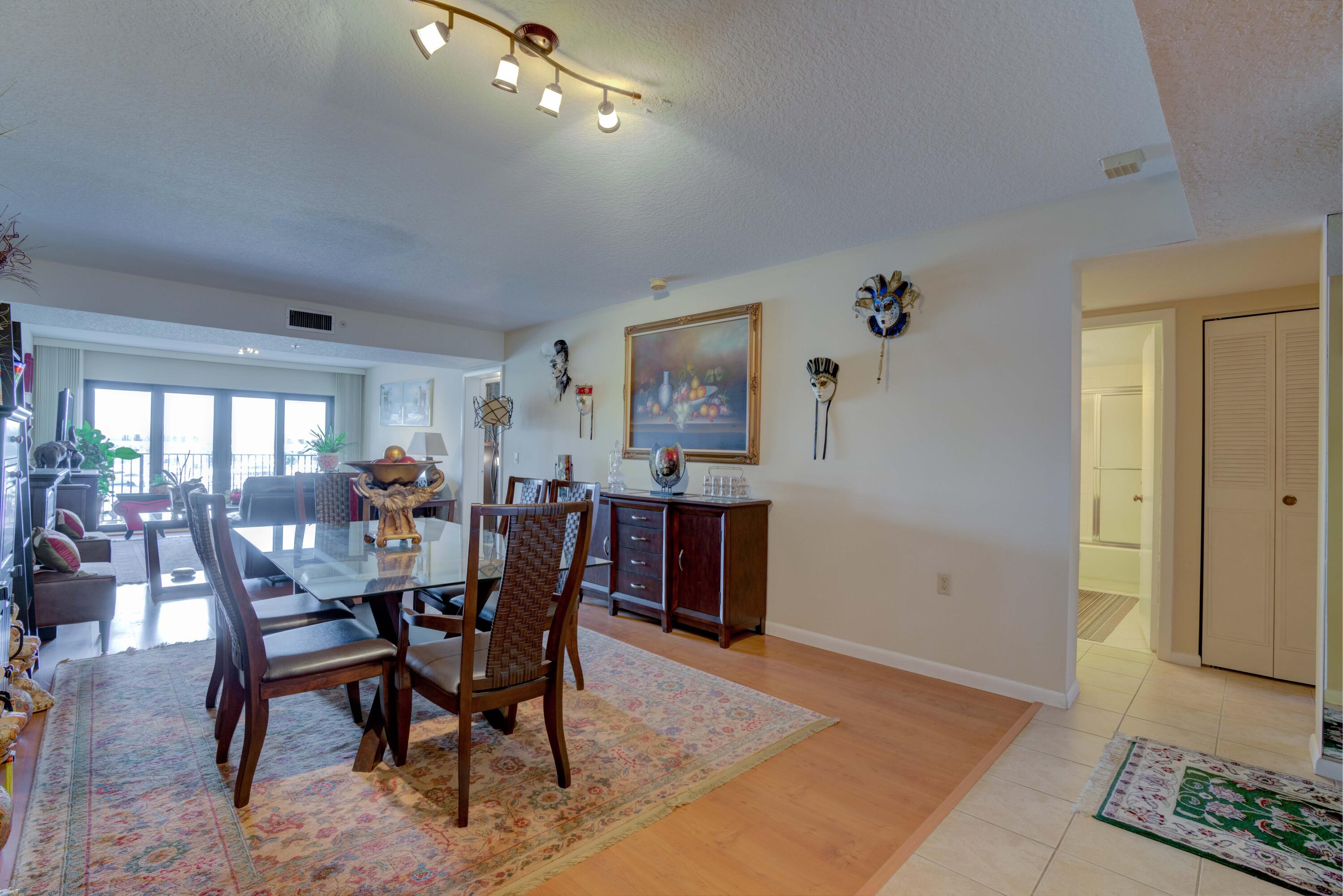 801 Seafarer Circle, Unit 404 Jupiter, FL 33477 - Photo 19 of 34 a view of a dining room with furniture