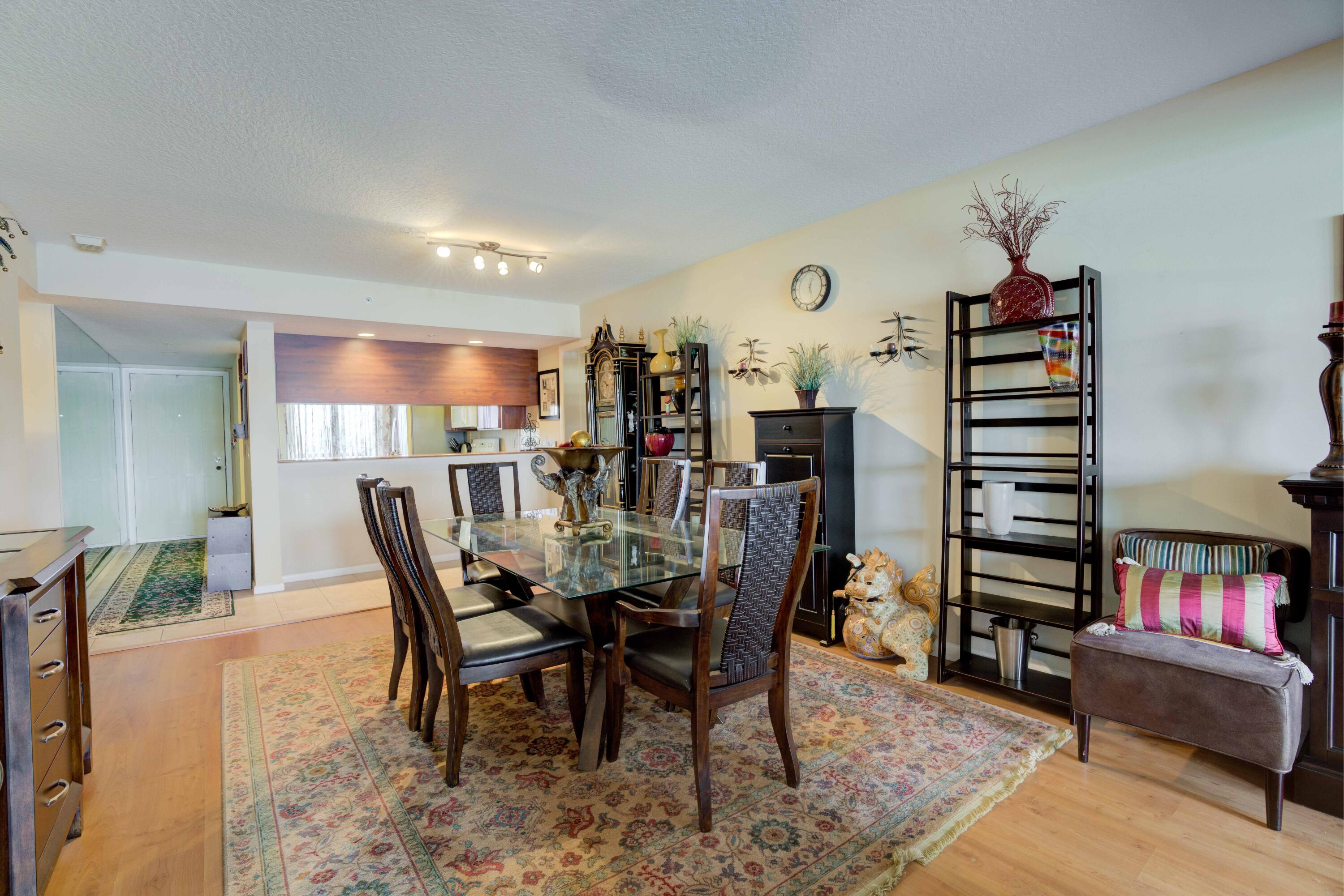 801 Seafarer Circle, Unit 404 Jupiter, FL 33477 - Photo 20 of 34 a dining room with furniture and wooden floor