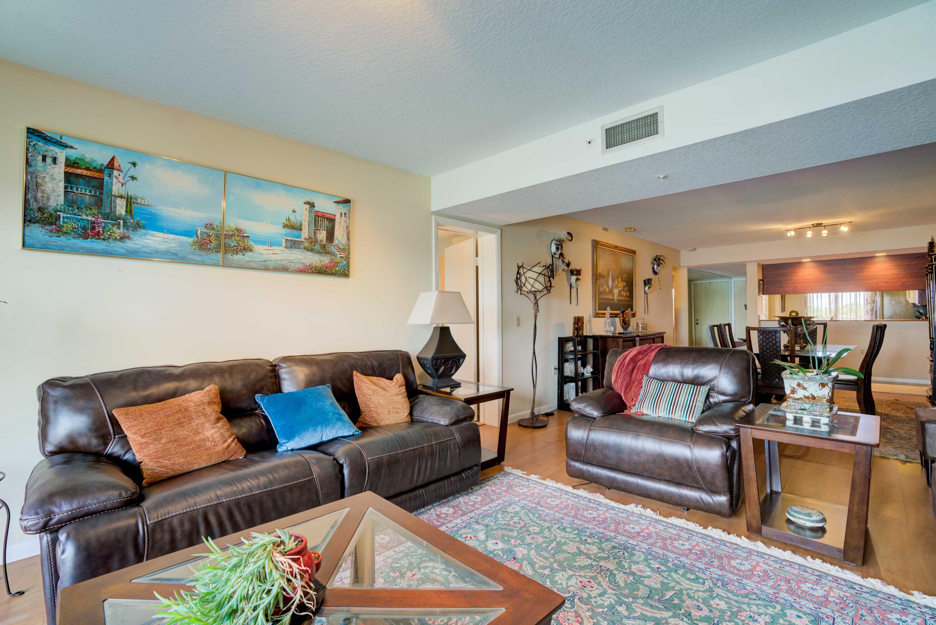 801 Seafarer Circle, Unit 404 Jupiter, FL 33477 - Photo 25 of 34 a living room with furniture and a couch