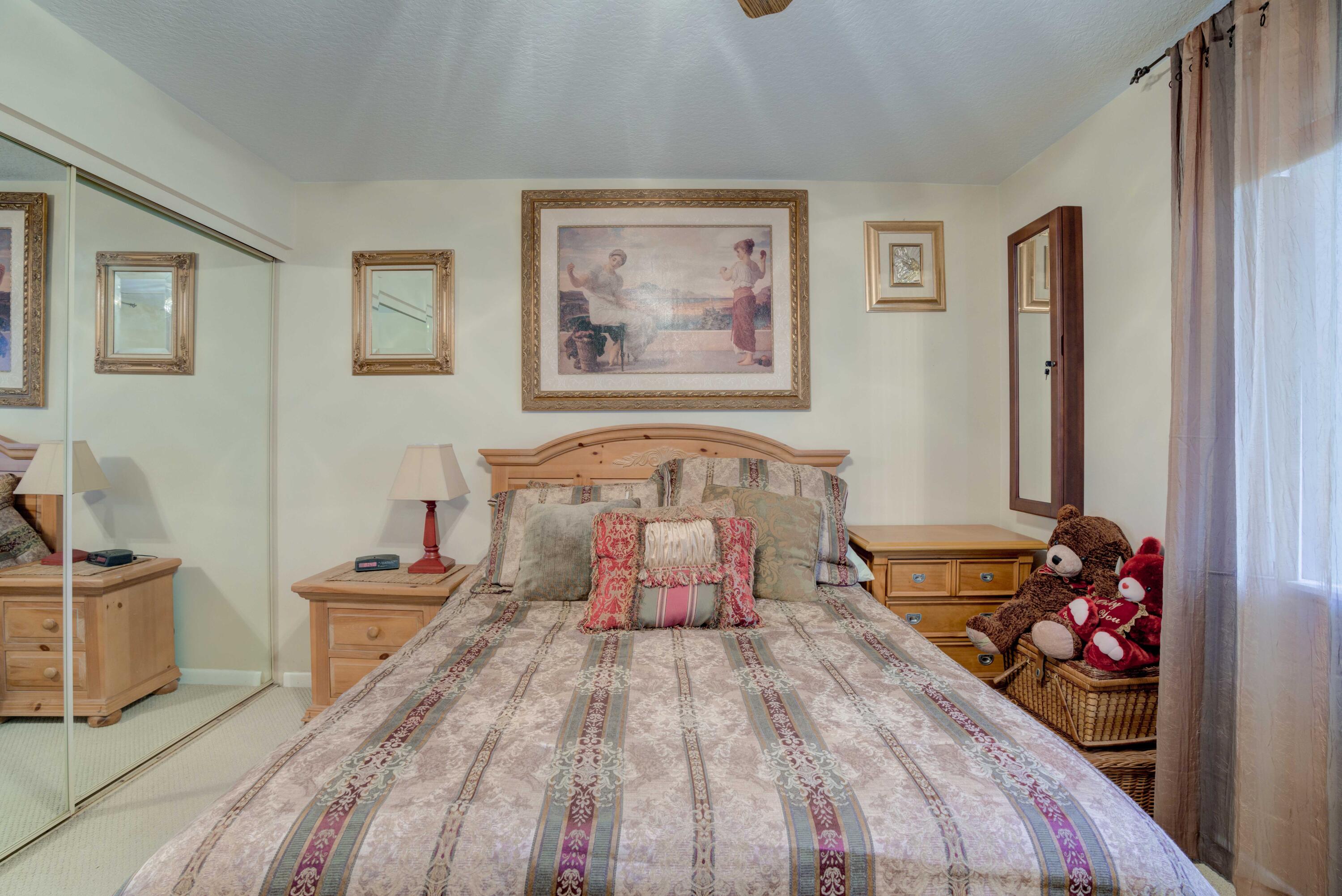 801 Seafarer Circle, Unit 404 Jupiter, FL 33477 - Photo 28 of 34 a bed room with a bed and a couch