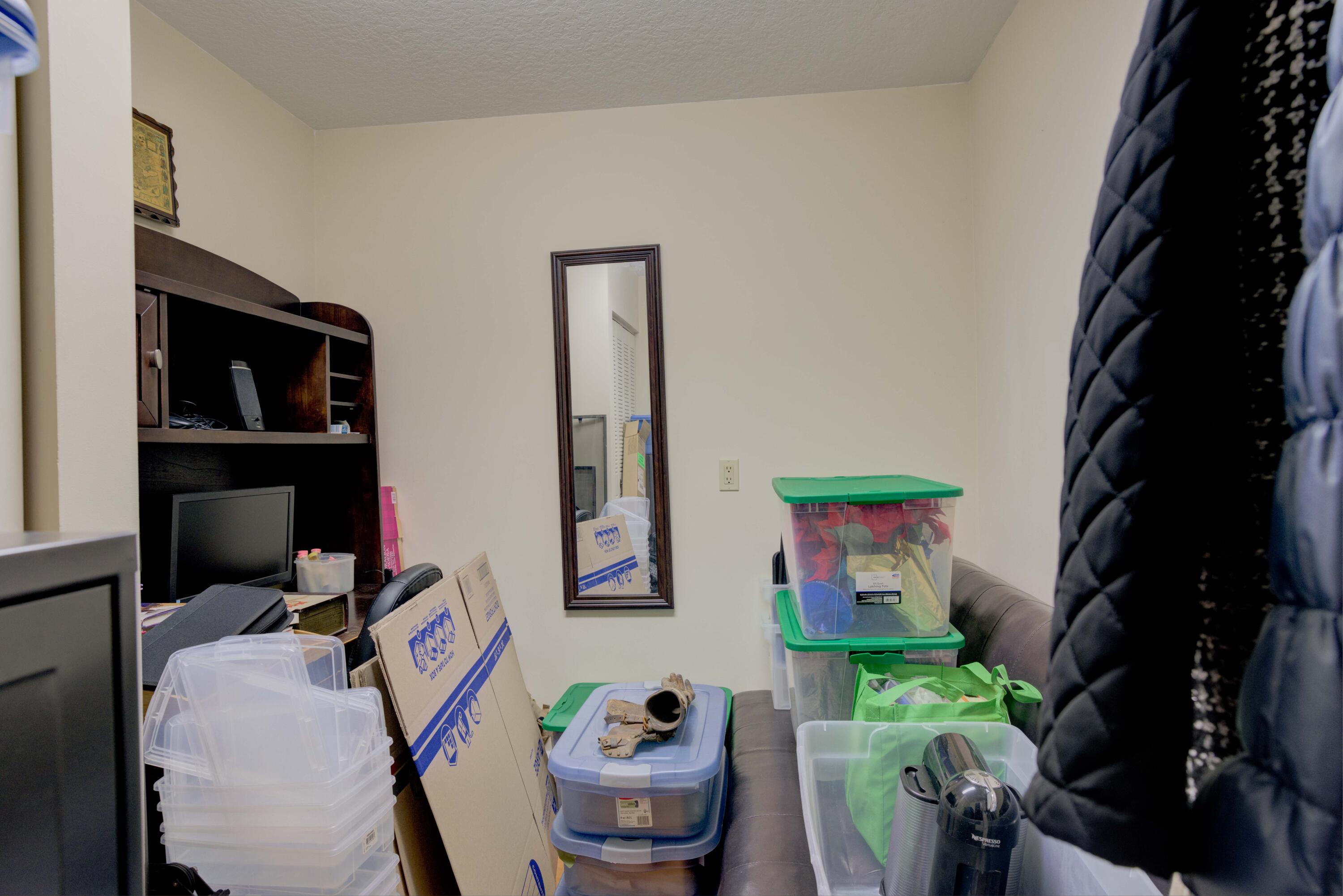 801 Seafarer Circle, Unit 404 Jupiter, FL 33477 - Photo 31 of 34 a living room with furniture and a flat screen tv