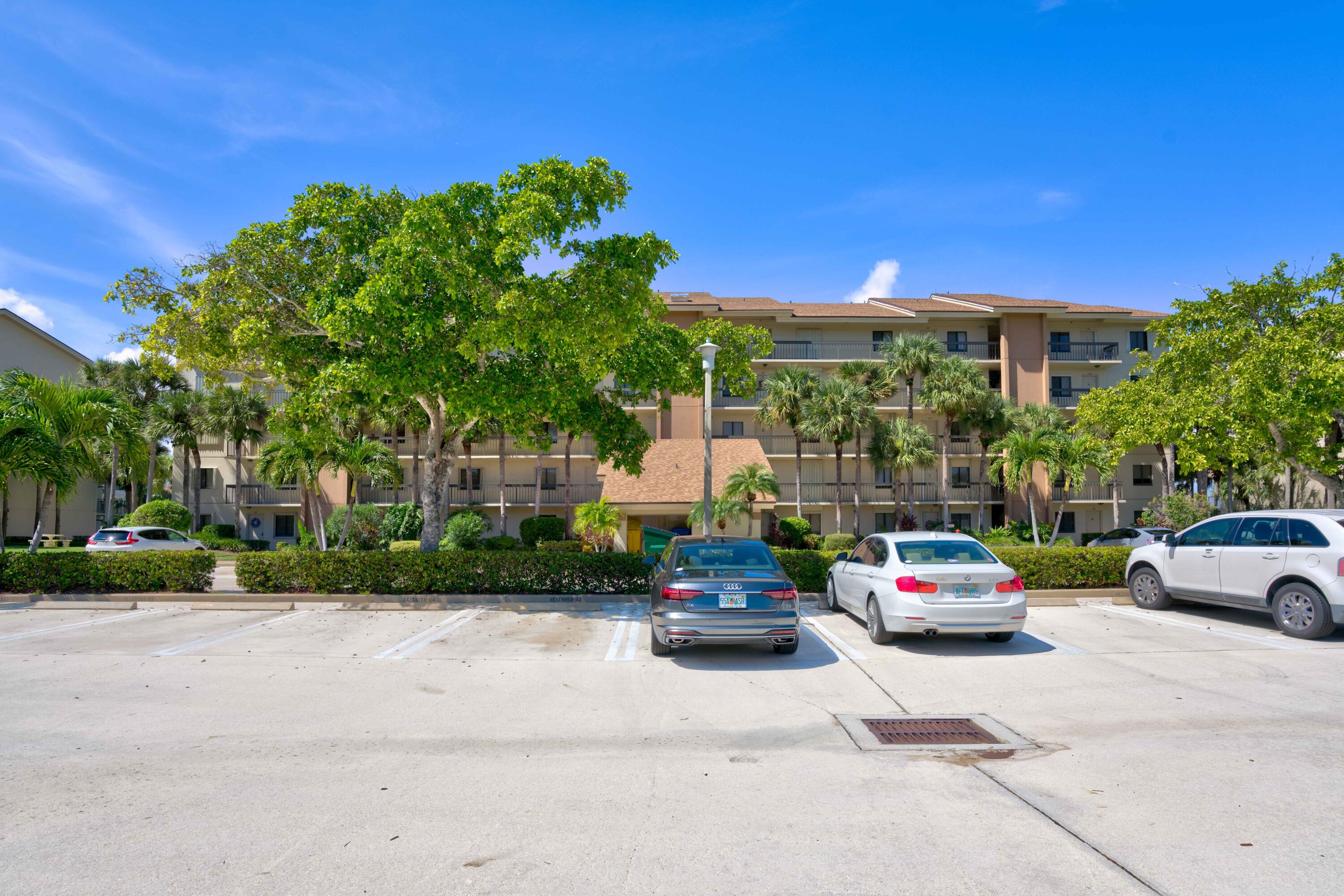 801 Seafarer Circle, Unit 404 Jupiter, FL 33477 - Photo 34 of 34 a car parked in front of a house