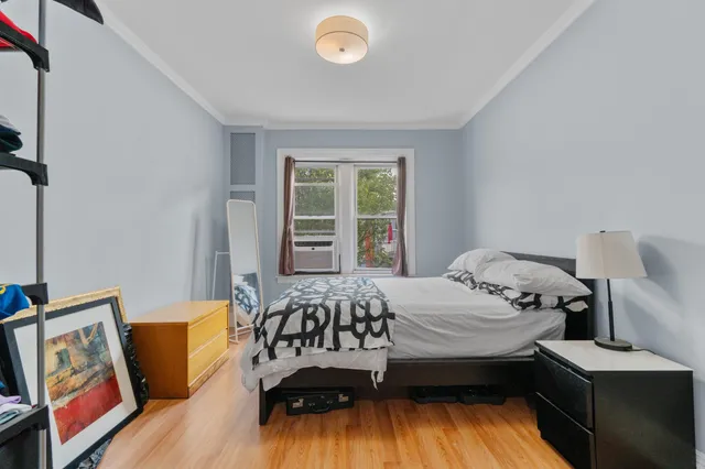 a bedroom with a bed and a couch