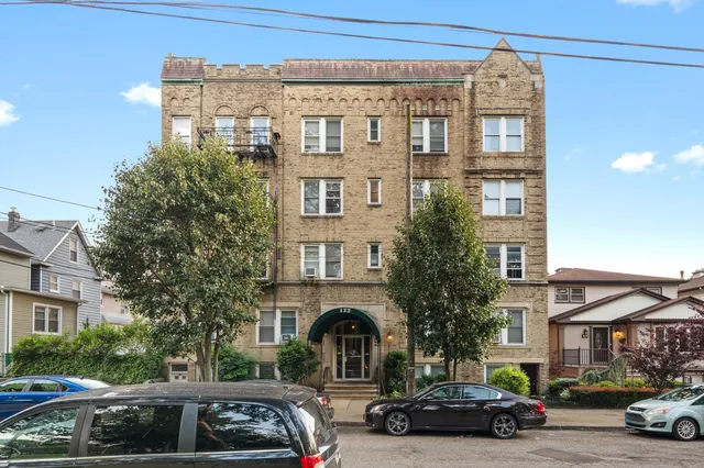 a view of a car parked in front of a building