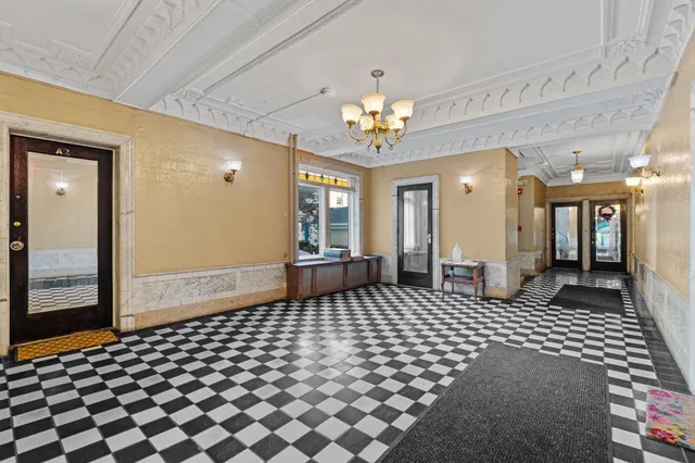 a bedroom with a bed and walk in closet