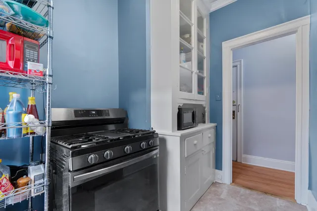 a kitchen with cabinets and appliances