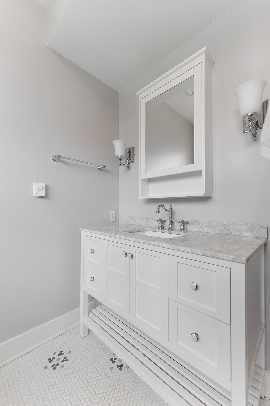 Undisclosed Address Whiting, IN 46394 - Photo 13 of 21 a bathroom with a sink and a mirror