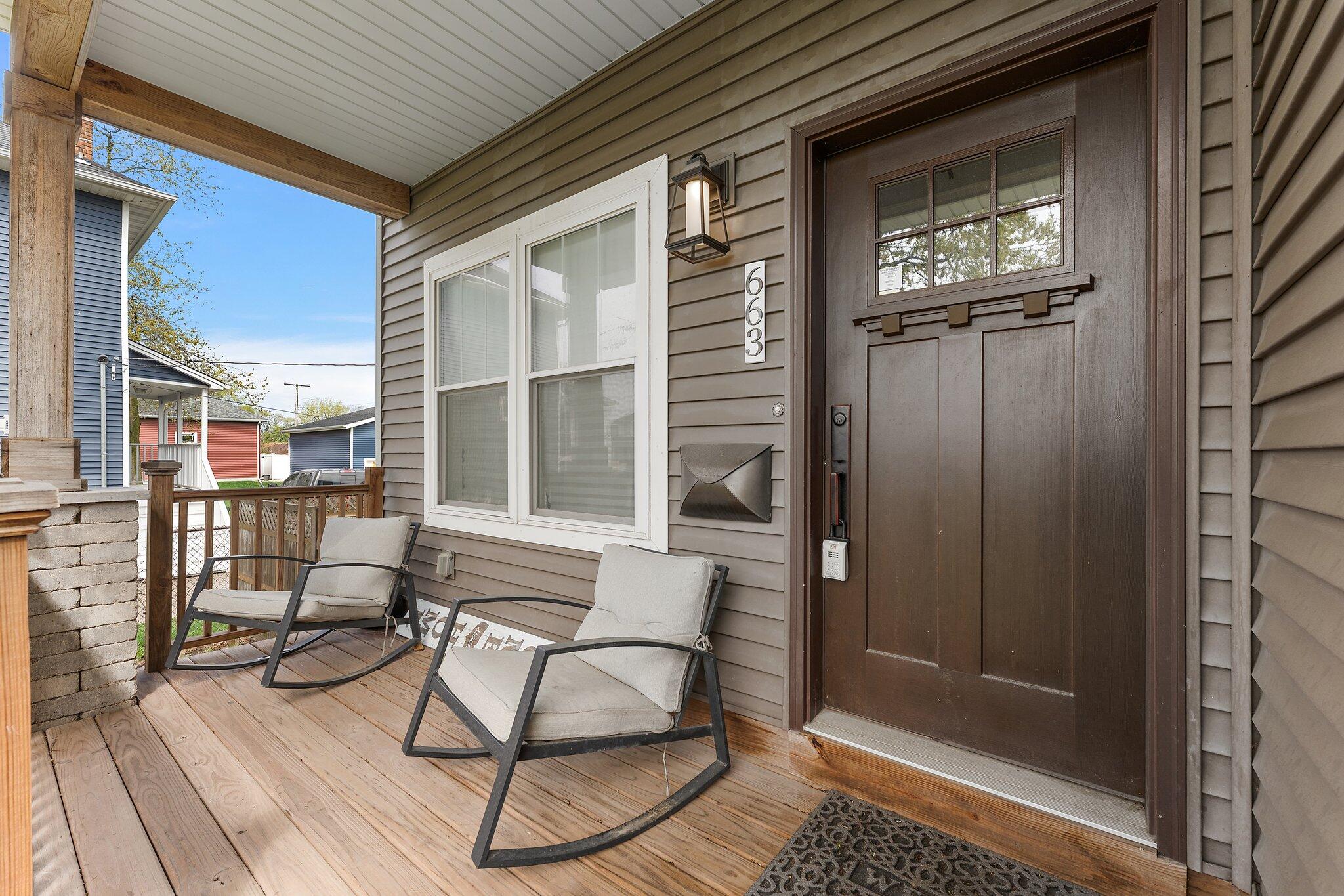 Undisclosed Address Whiting, IN 46394 - Photo 2 of 21 a view of a balcony with furniture and floor to ceiling window