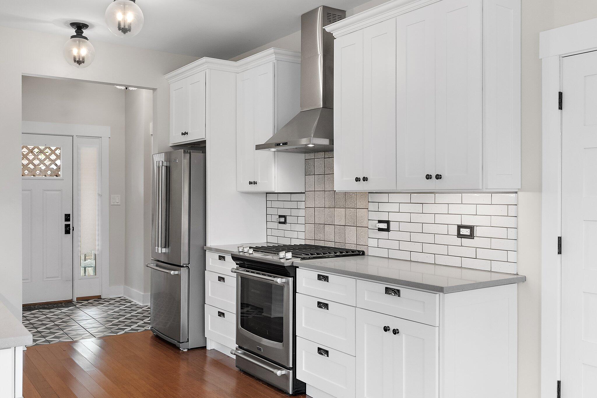 Undisclosed Address Whiting, IN 46394 - Photo 5 of 21 a kitchen with stainless steel appliances granite countertop a sink stove and refrigerator