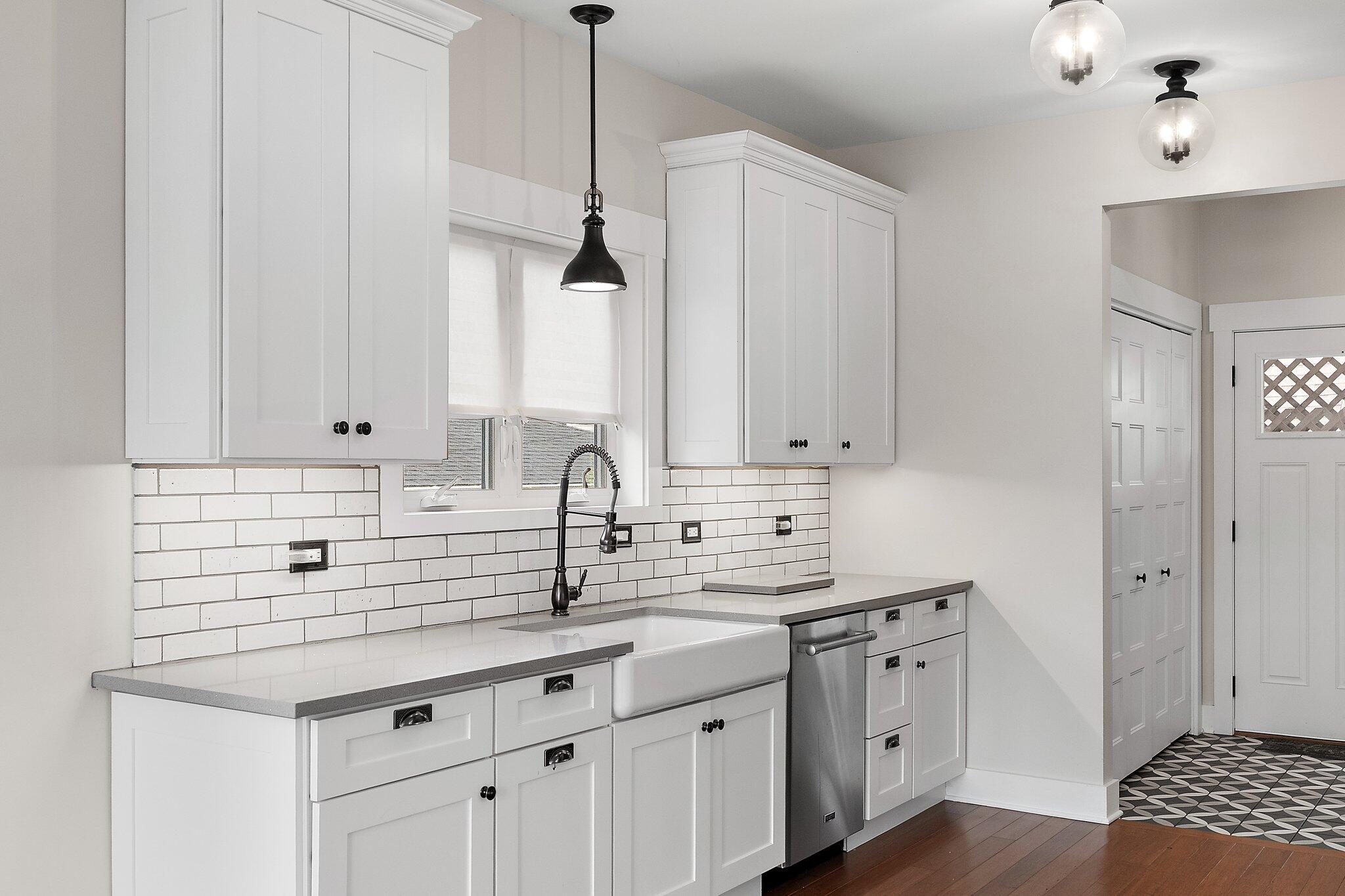 Undisclosed Address Whiting, IN 46394 - Photo 6 of 21 a kitchen with stainless steel appliances granite countertop a sink a stove and cabinets