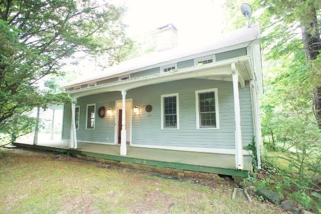 128 North Stamford Road Stamford, CT 06903 - Photo 1 of 1 a view of house with backyard and glass windows