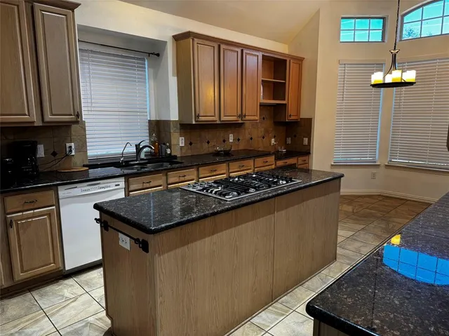 a bathroom with a bathtub sink and mirror