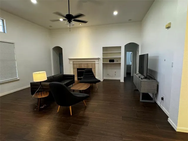 a living room with furniture and a fireplace