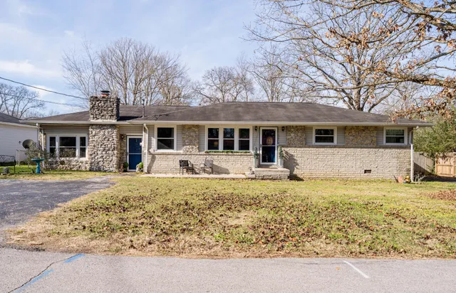 a front view of house with yard patio and swimming pool