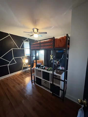 a room with lots of furniture and wooden floor