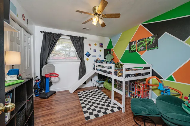 a room with furniture and a wooden floor