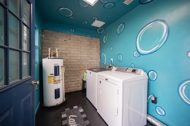 a living room with furniture and a ceiling fan