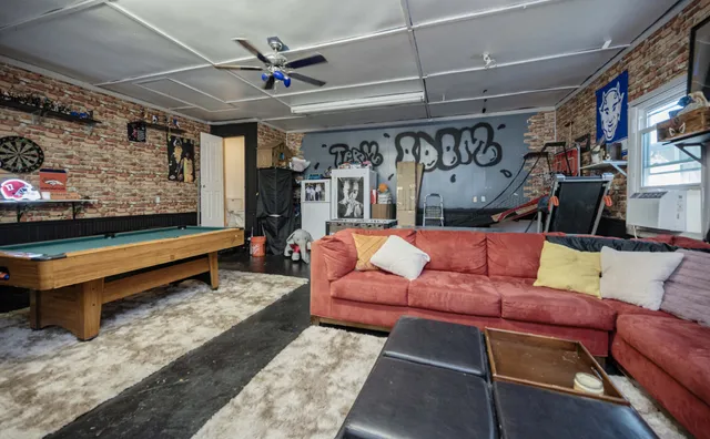 a room with furniture and a flat screen tv