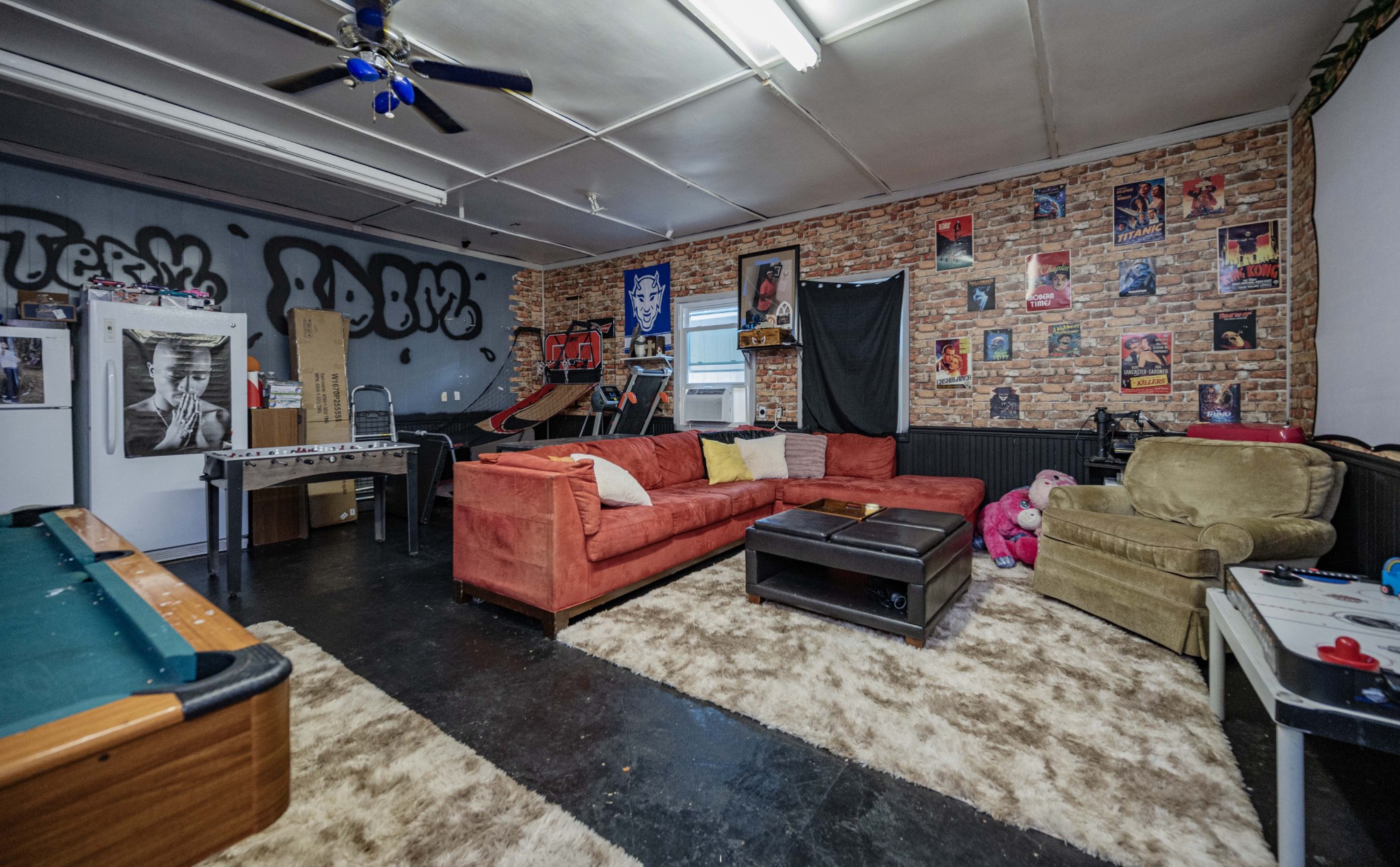 1704 3rd Avenue Manchester, TN 37355 - Photo 25 of 34 a bedroom with furniture and a flat screen tv