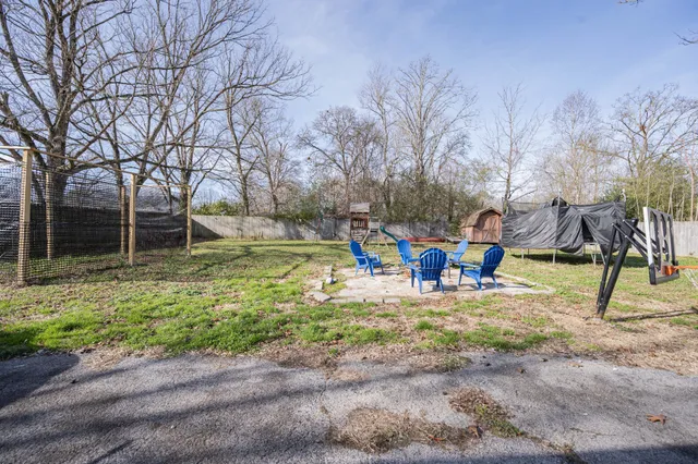 a view of a house with garden and sitting area