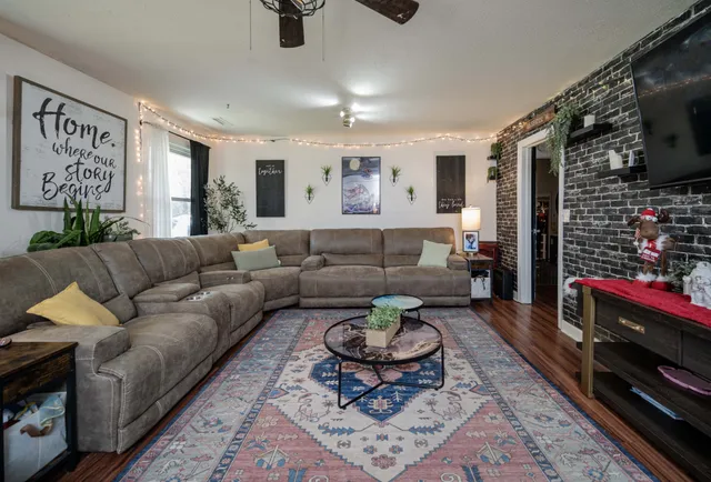 a living room with furniture and a rug