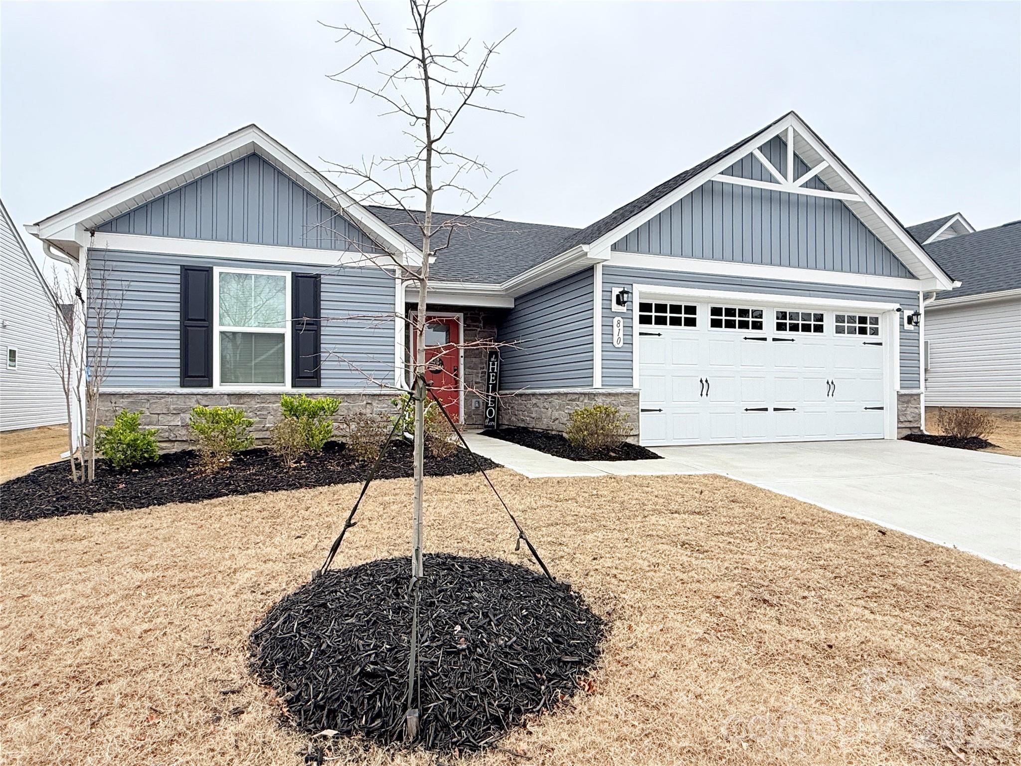 810 Purslane Street Lancaster, SC 29720 - Photo 1 of 24 a front view of a house with a yard