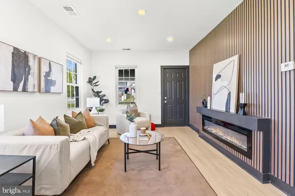 a living room with furniture and a rug