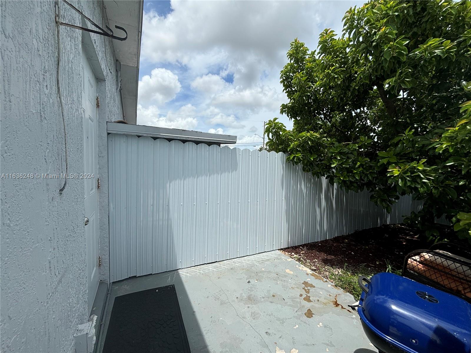 11001 Southwest 56th Street, Unit 2 Miami, FL 33165 - Photo 8 of 10 a backyard of a house
