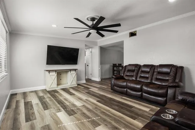 a living room with a couch and a flat screen tv