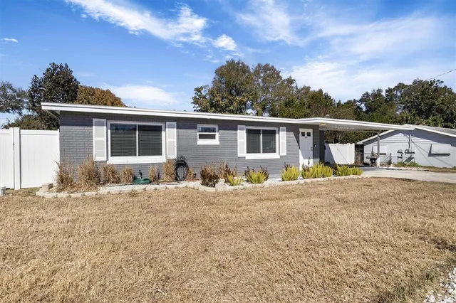 a house view with a backyard space