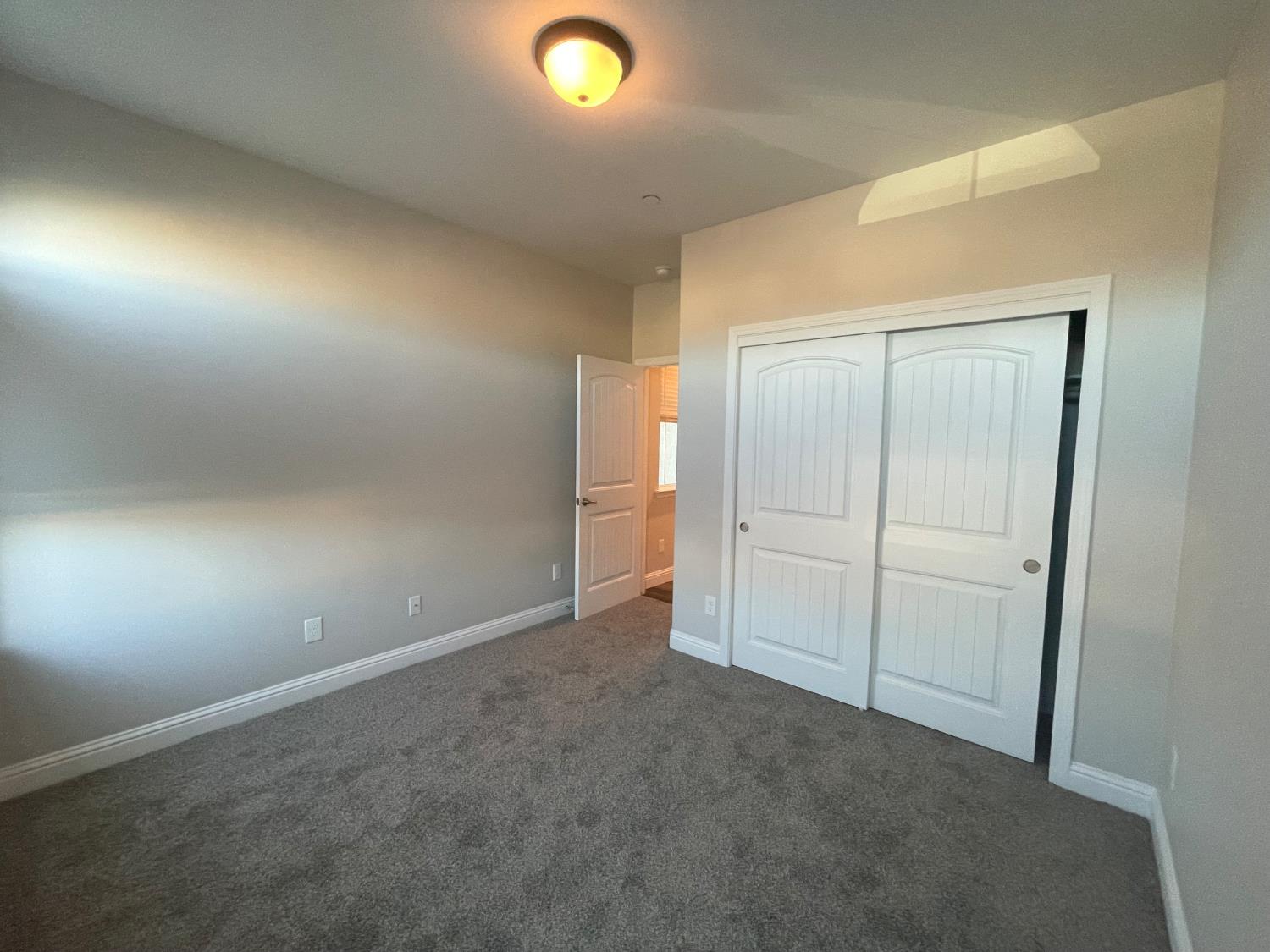 105 South Walnut Avenue Kerman, CA 93630 - Photo 17 of 22 an empty room with an empty space
