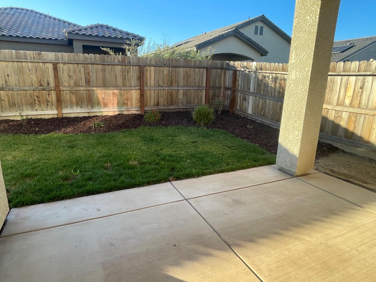 105 South Walnut Avenue Kerman, CA 93630 - Photo 20 of 22 a view of outdoor space and yard