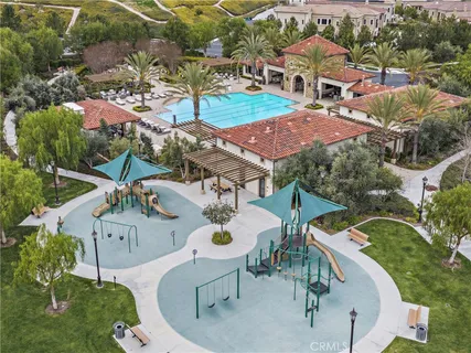 an aerial view of a house with outdoor space patio and lake view