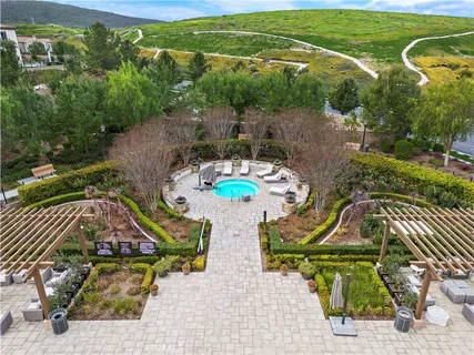 an aerial view of a house with garden space ocean view