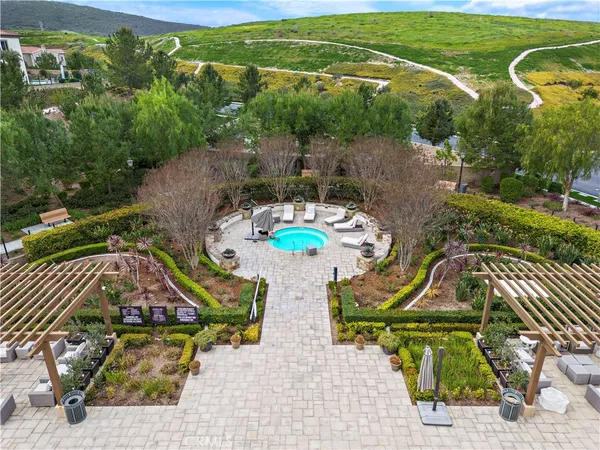 an aerial view of a house with garden space ocean view