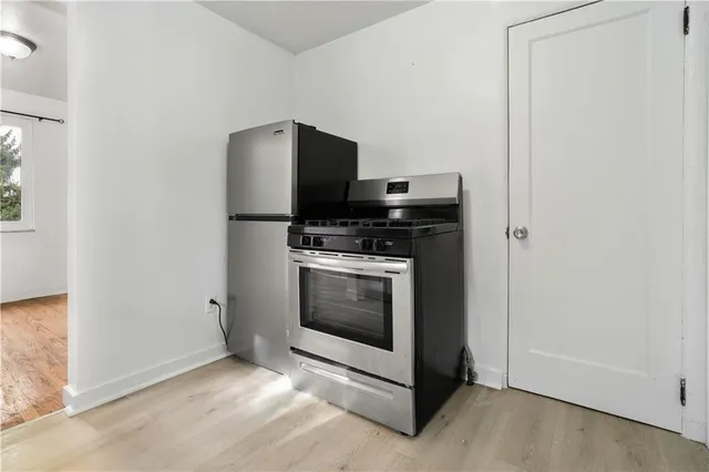 a kitchen with a stove and a microwave