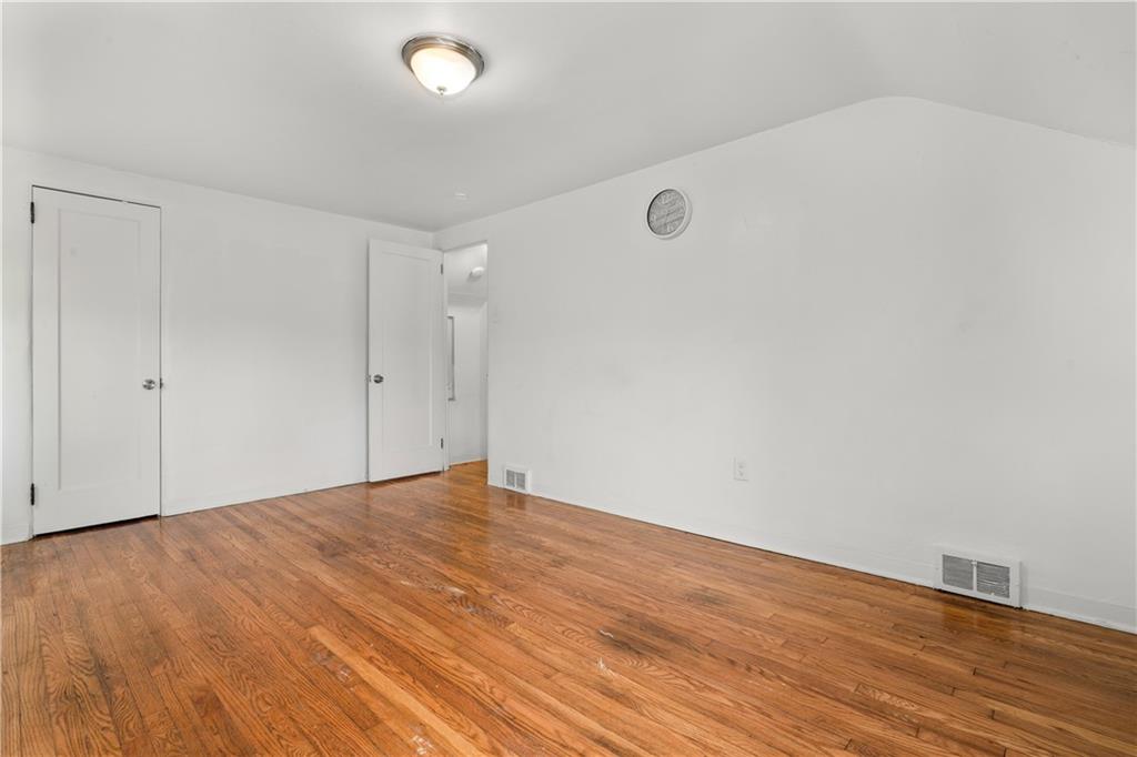 1525 Collins Road Pittsburgh, PA 15221 - Photo 10 of 21 a view of an empty room with wooden floor