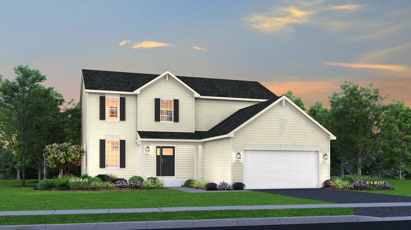 a front view of a house with a yard and trees