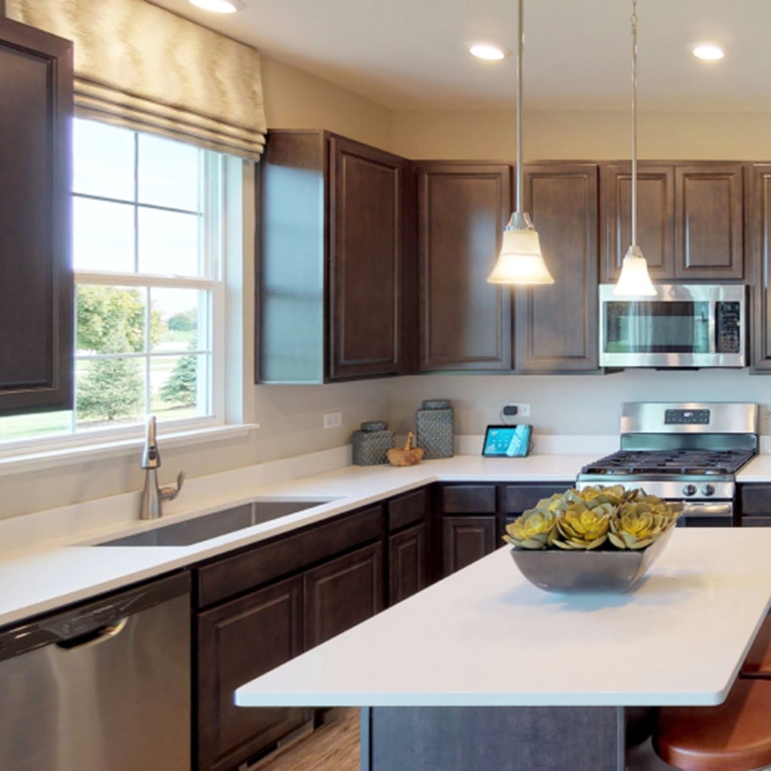 227 Conway Street Elburn, IL 60119 - Photo 3 of 14 a kitchen with a sink a window and chairs