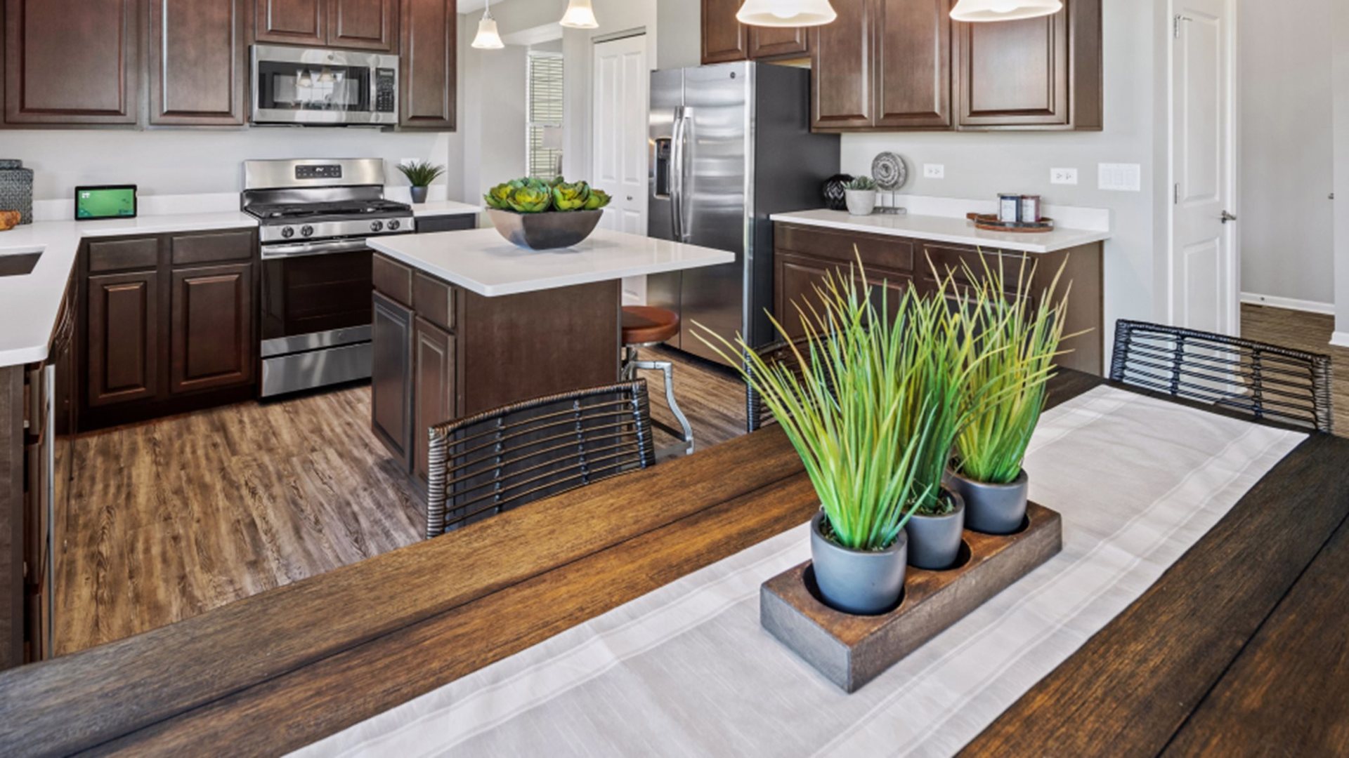 227 Conway Street Elburn, IL 60119 - Photo 4 of 14 a kitchen with stainless steel appliances granite countertop a refrigerator a stove and a sink