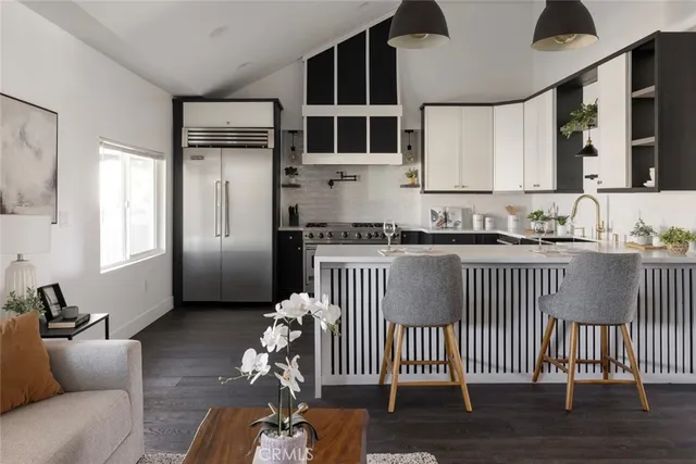 a kitchen with a refrigerator and a sink
