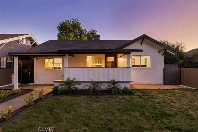 a front view of house and yard with green space